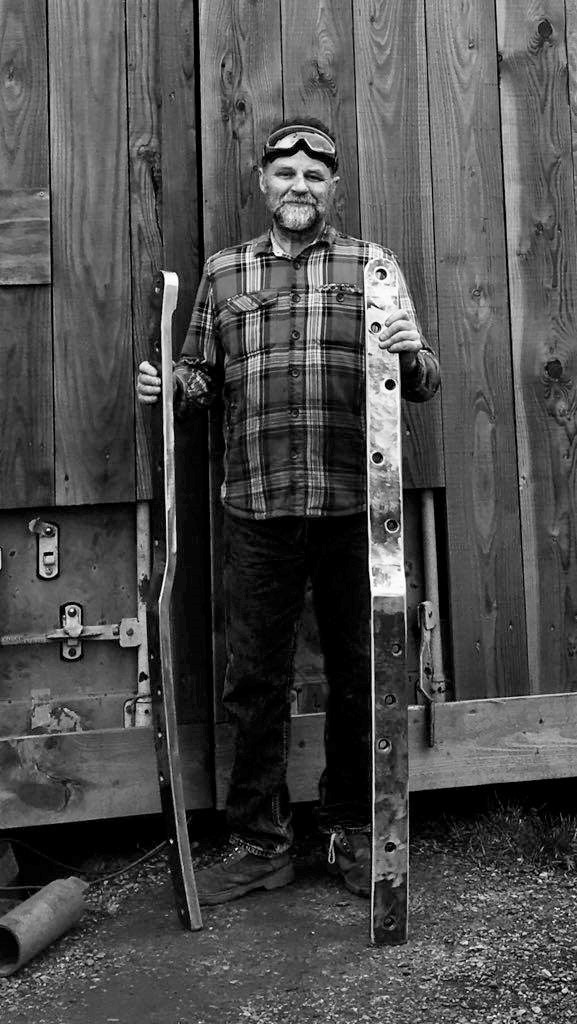 Dave Webster at the workshop with a pair of newly completed chain plates.